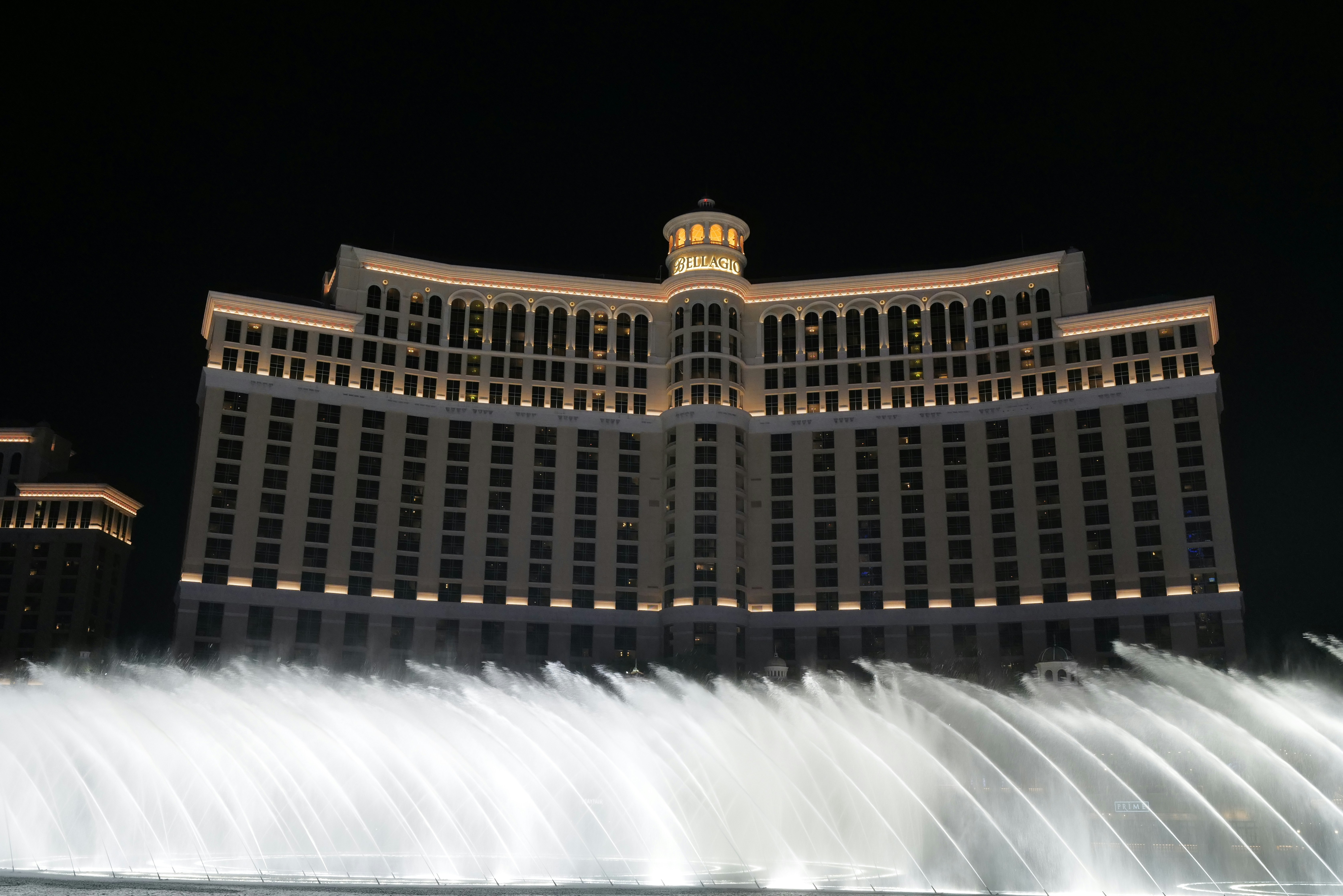 Bellagio hotel and fountains at night