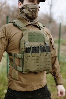 Man wearing tactical vest with rifle magazines