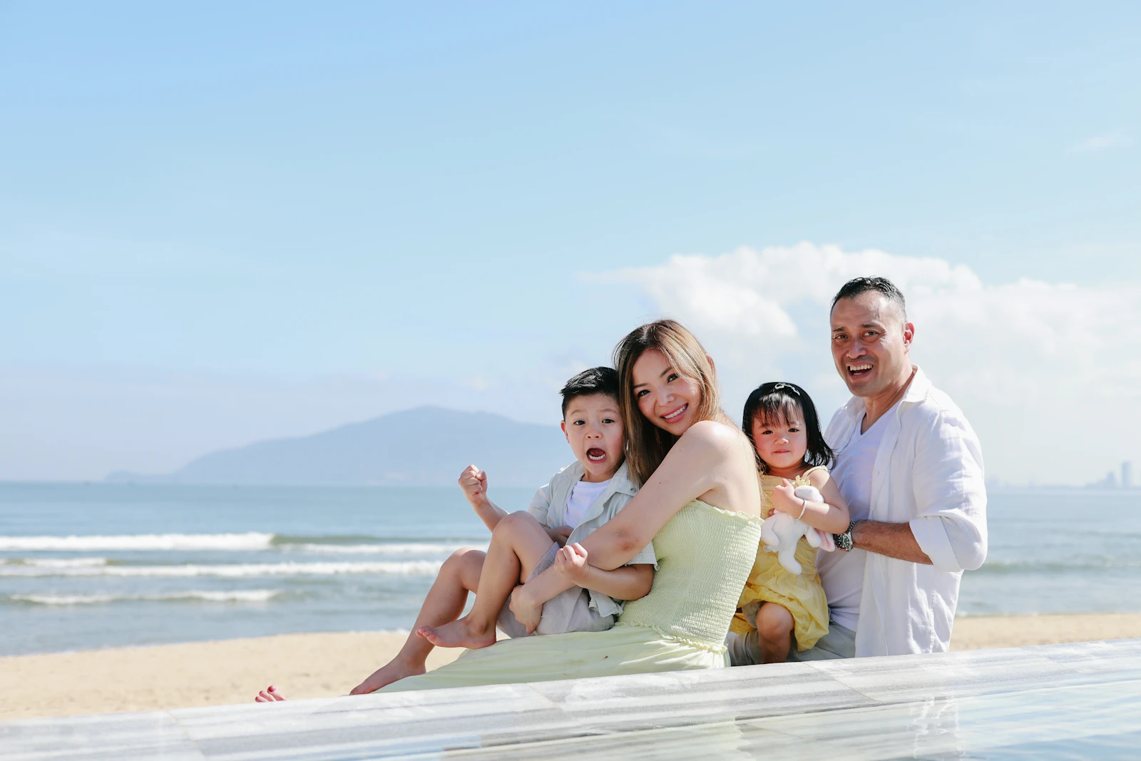A happy family enjoying a sunny beach getaway