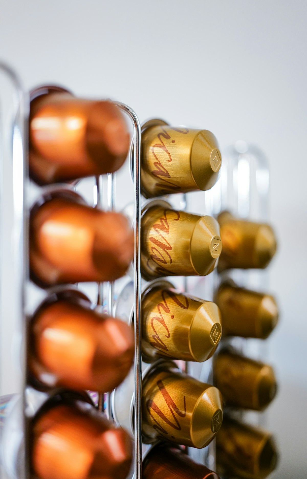 Rows of coffee capsules organized in a holder — per-capsule pricing drives consumer comparison in China's capsule market