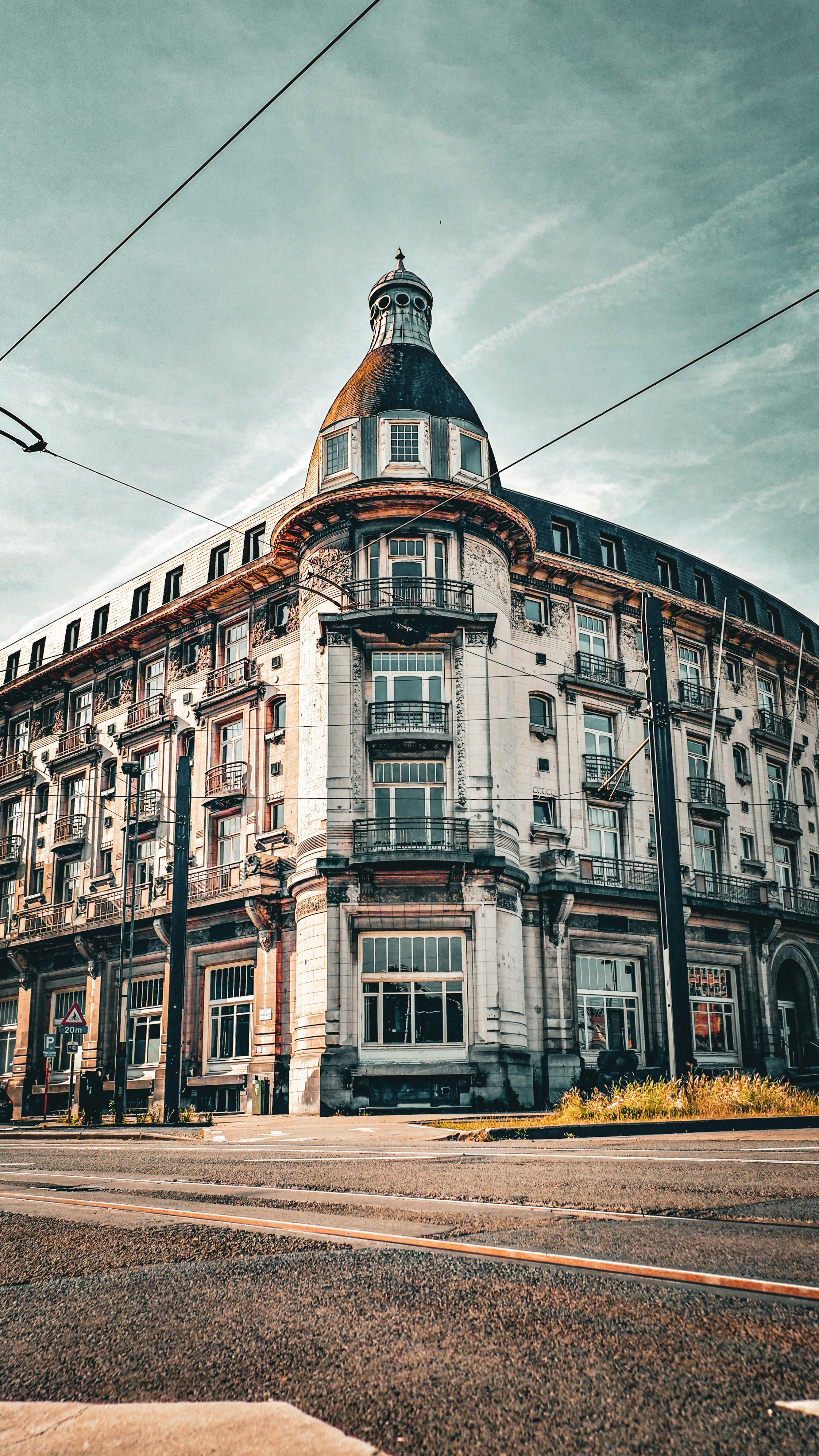 Ornate building with a dome against a cloudy sky