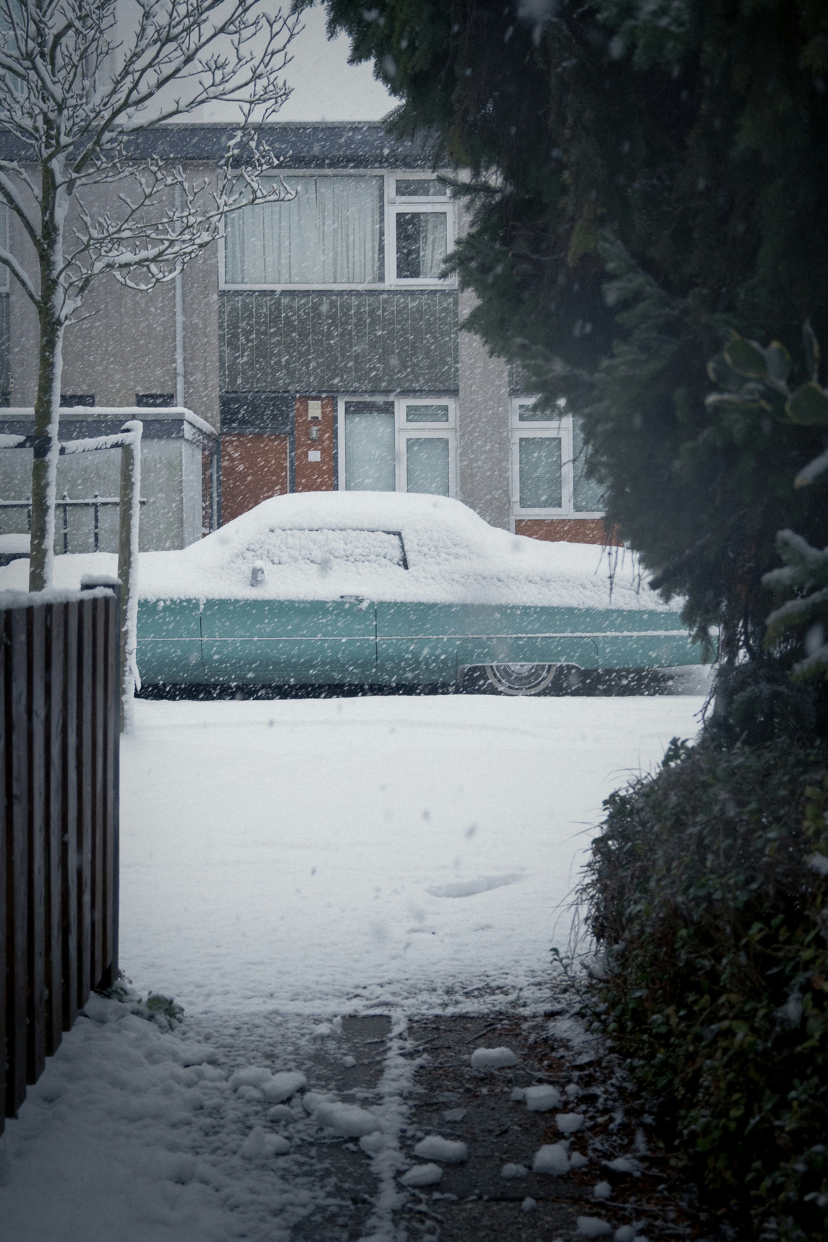 Car covered in snow on a winter day