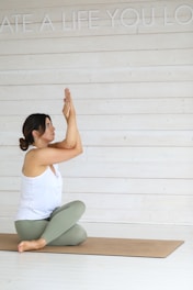 Woman in yoga pose on mat
