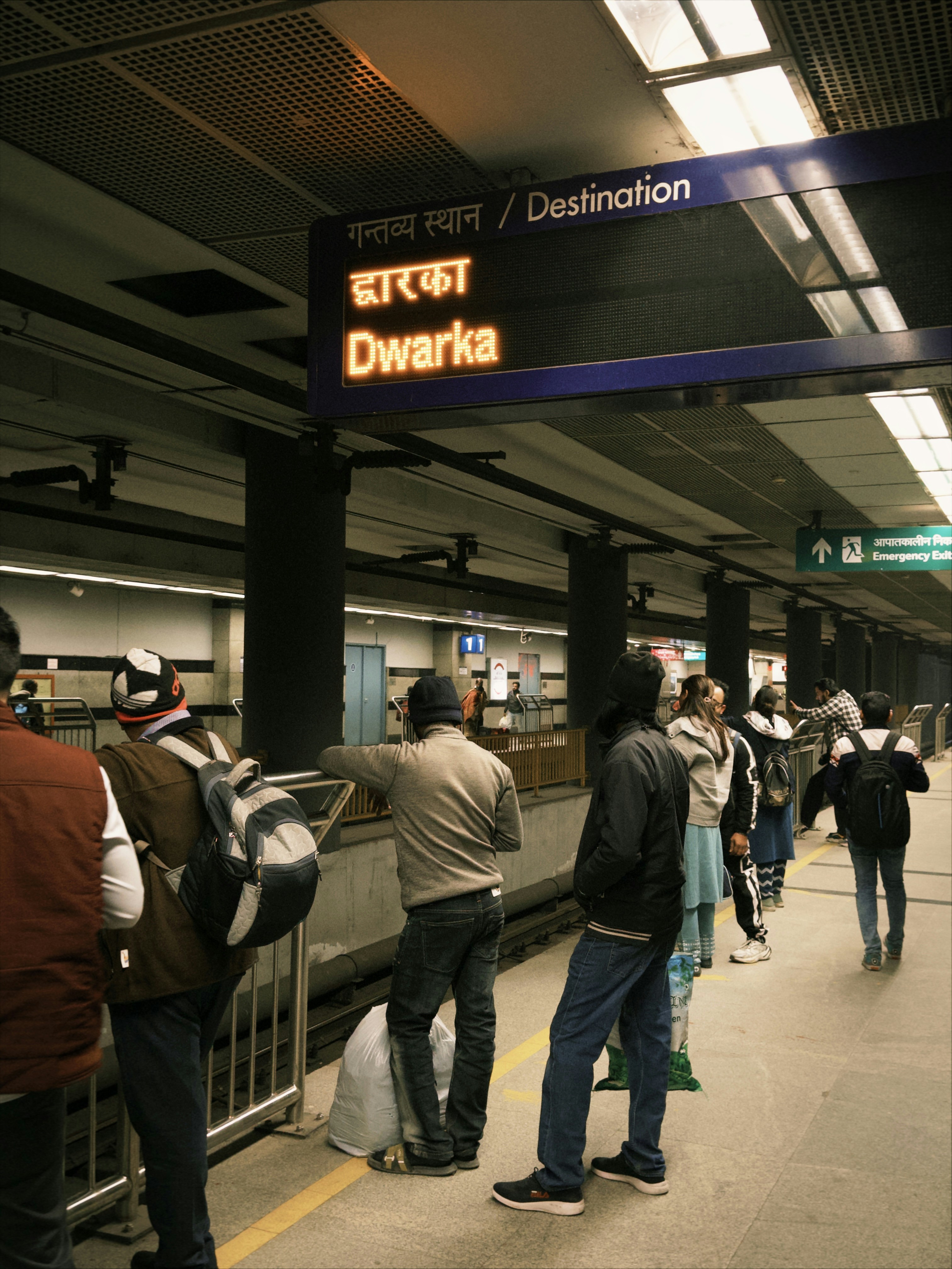 People waiting on a subway platform for train