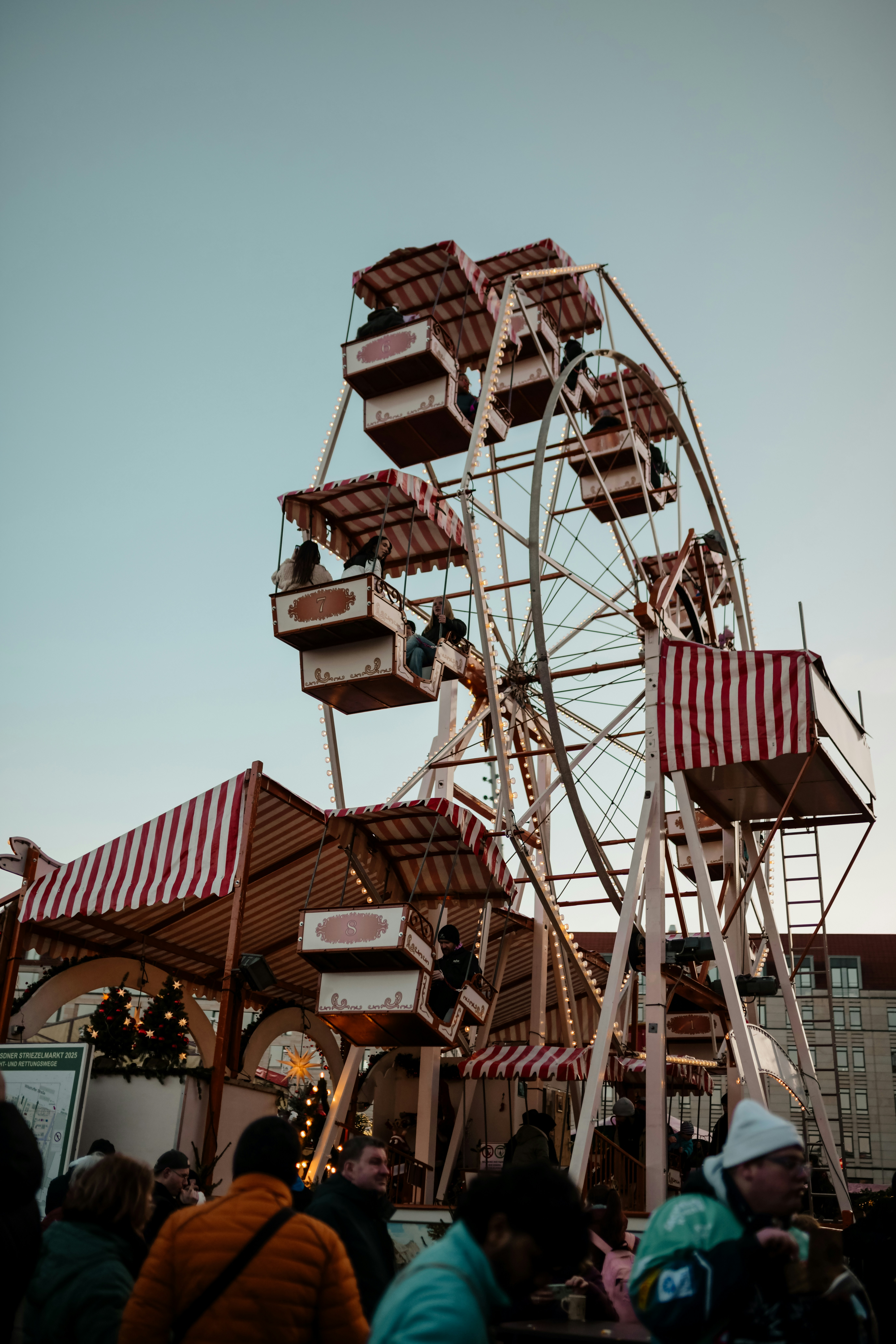 Ferris wheel at a festive market at dusk