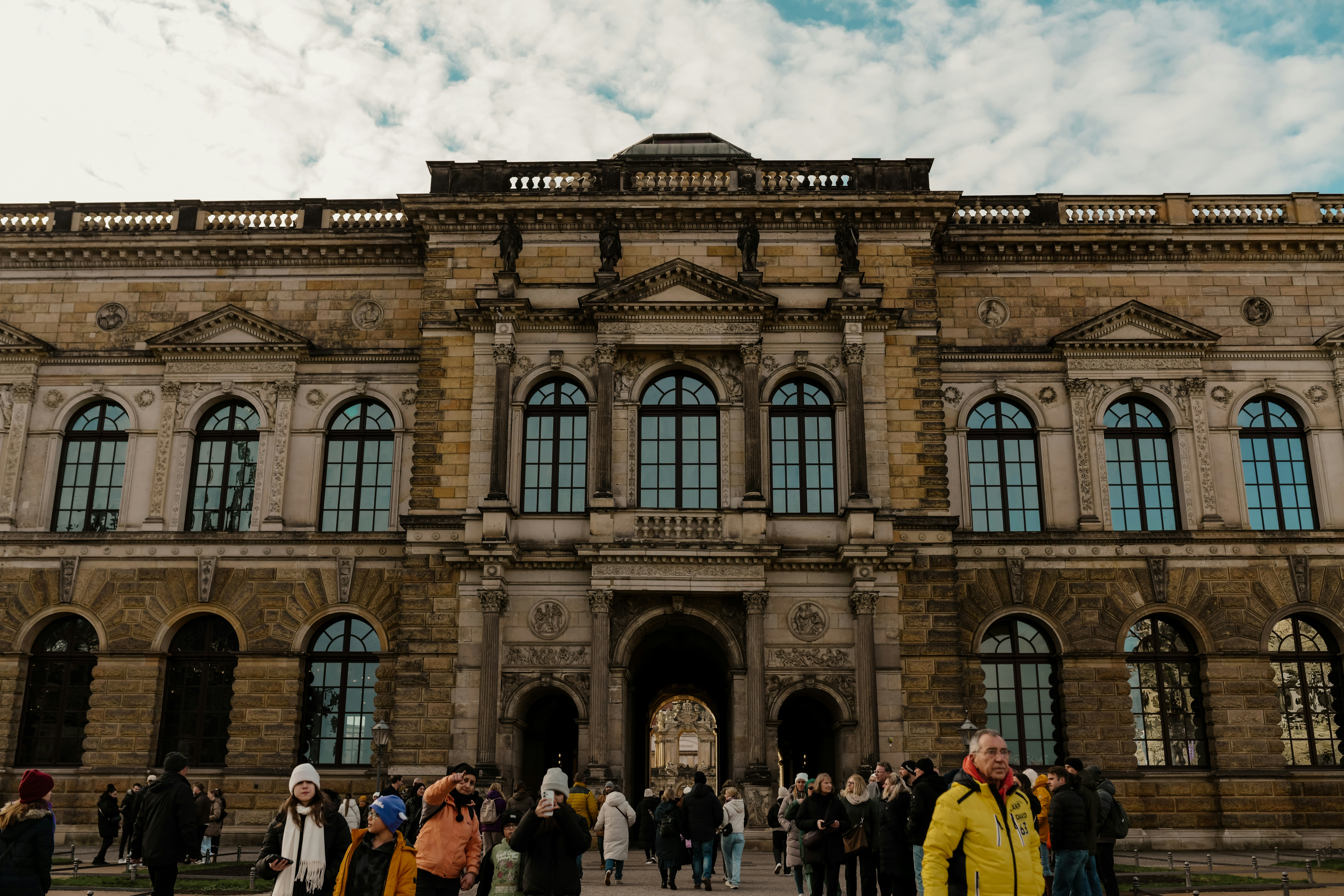 Ornate historic building with people walking outside