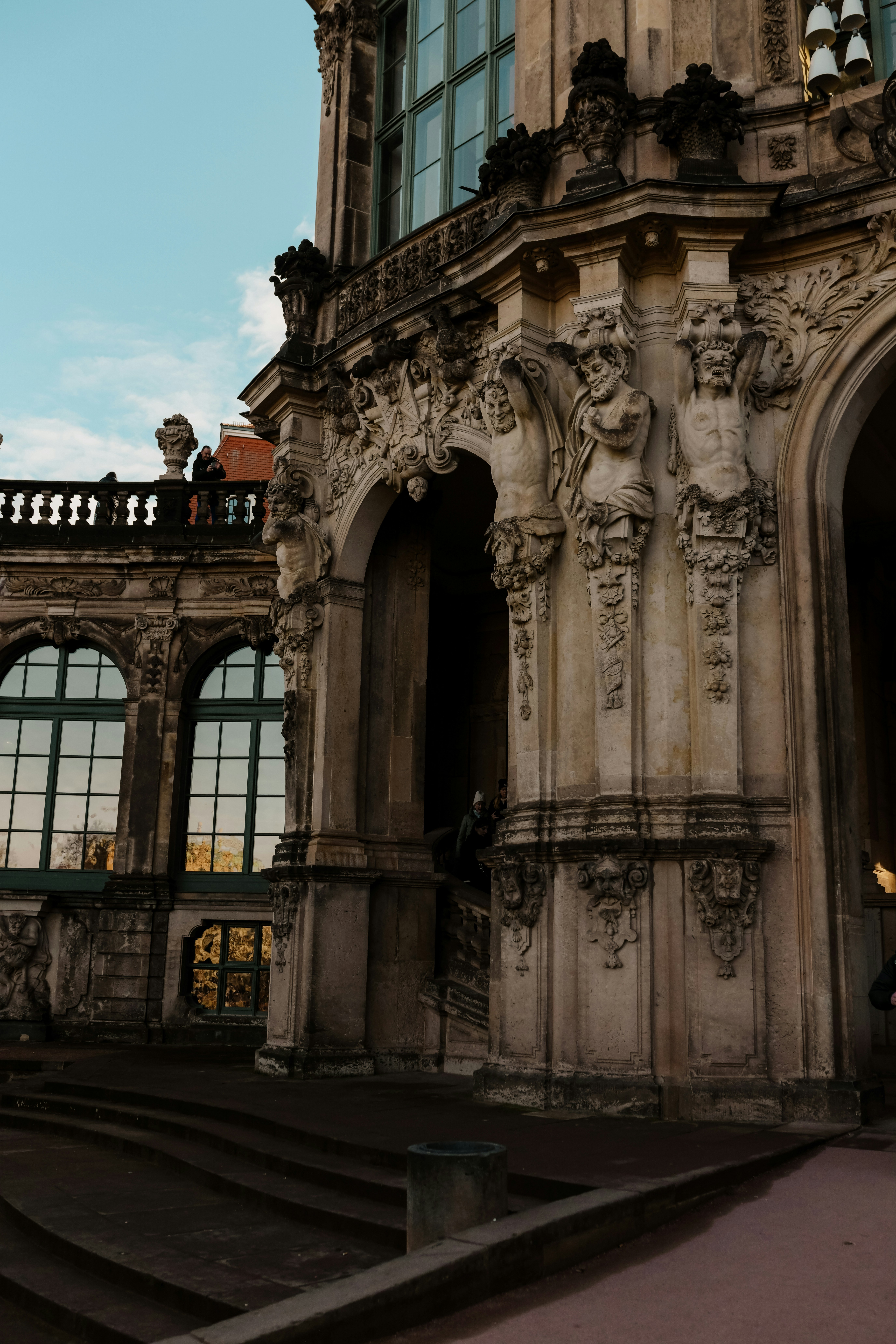 Ornate baroque architecture with arched entrances and sculptures.