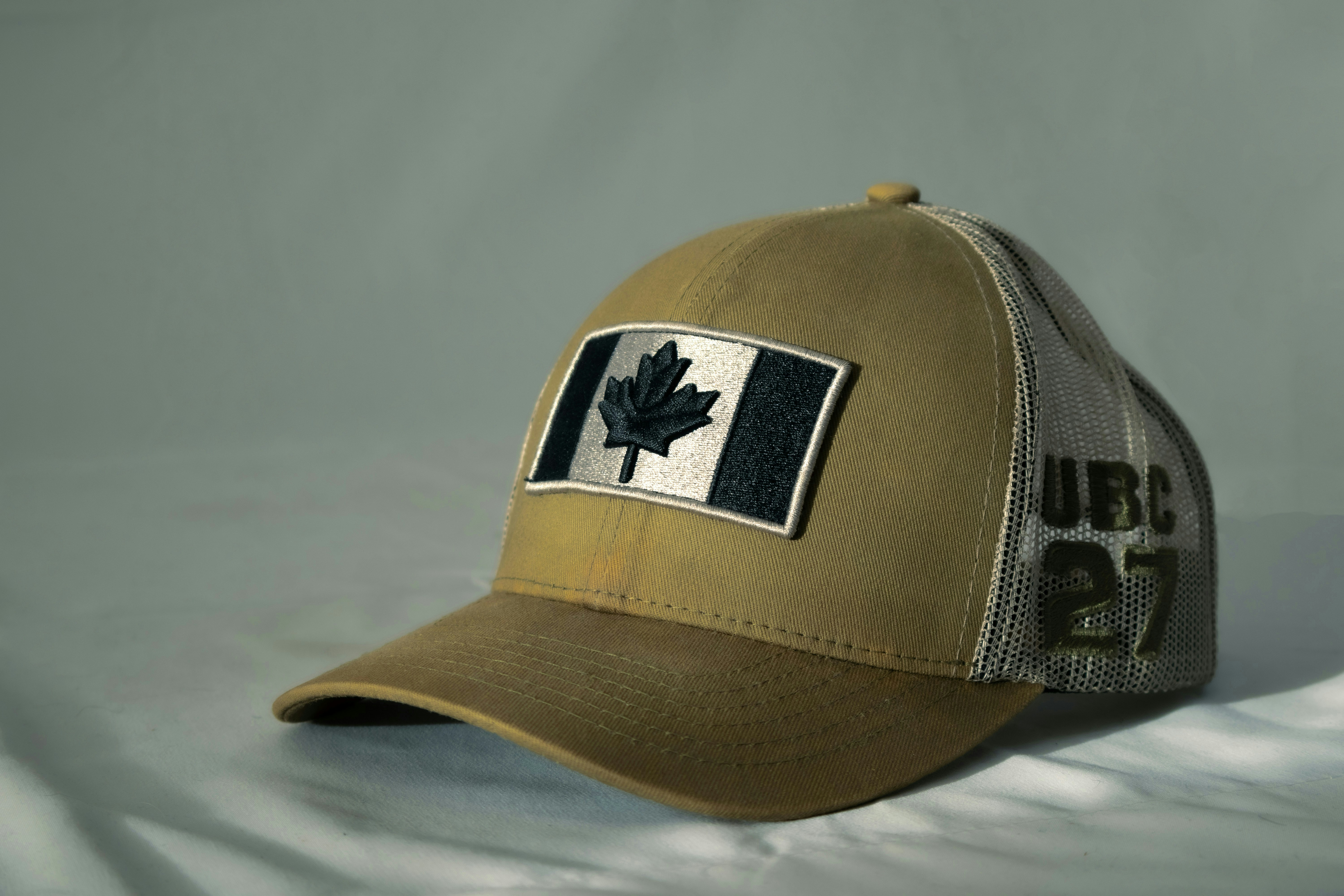 Tan baseball cap with canadian flag patch