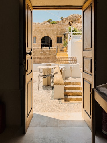 Sunlit courtyard with linen-draped tables