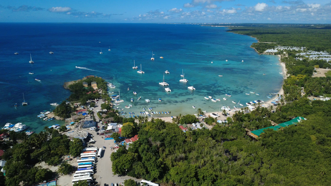 Boats anchored in a clear blue tropical bay
