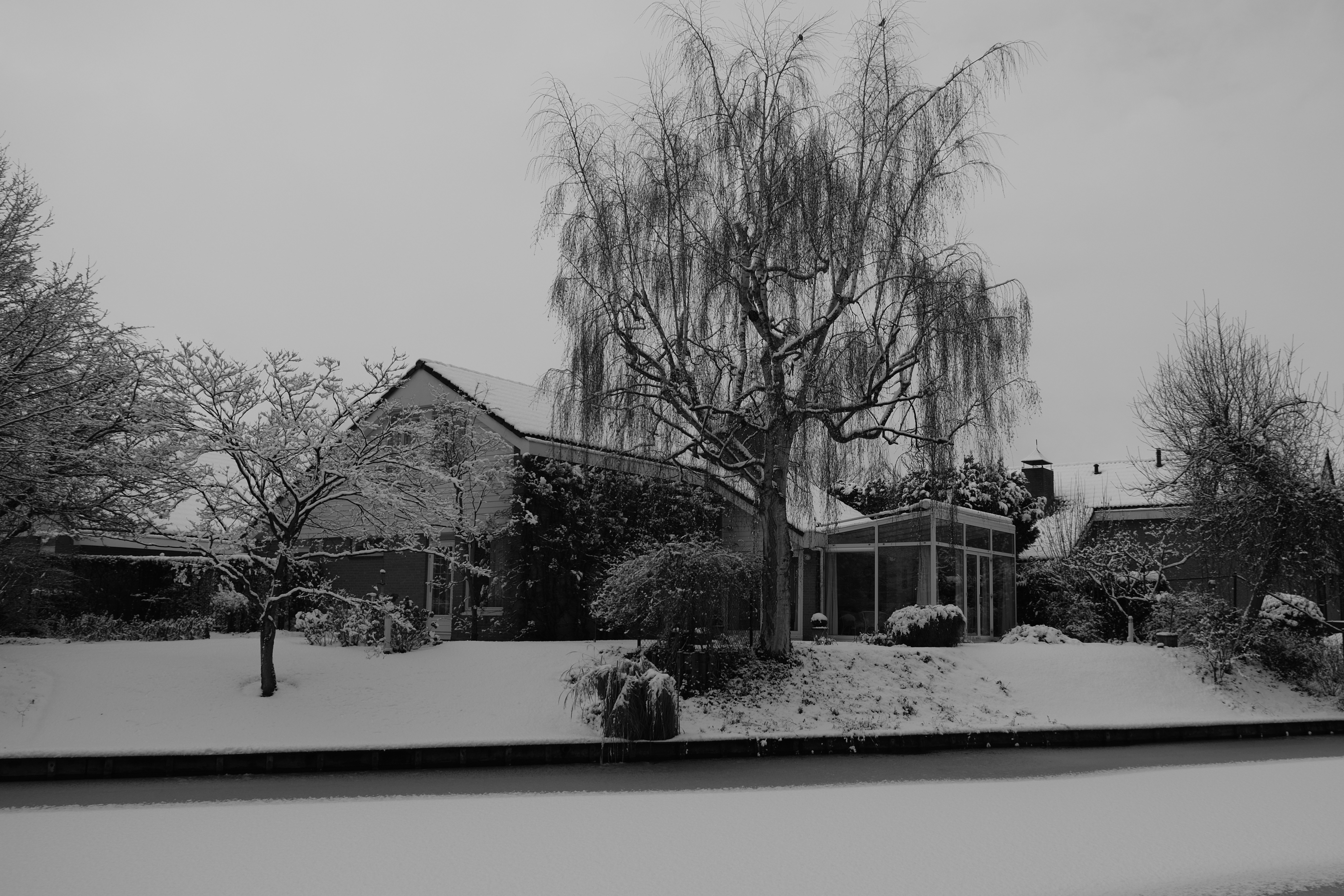 home in snowy New England setting - ducted heat pump installation cost