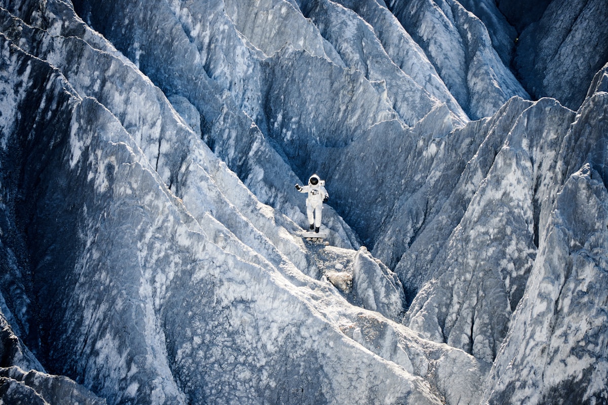 Astronaut standing on a rocky alien landscape