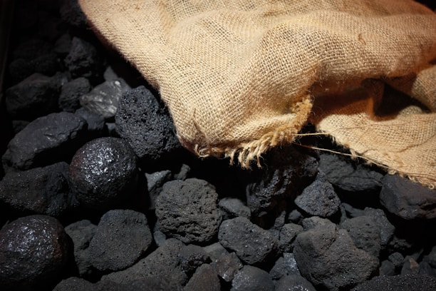 Pile of coal with a burlap sack