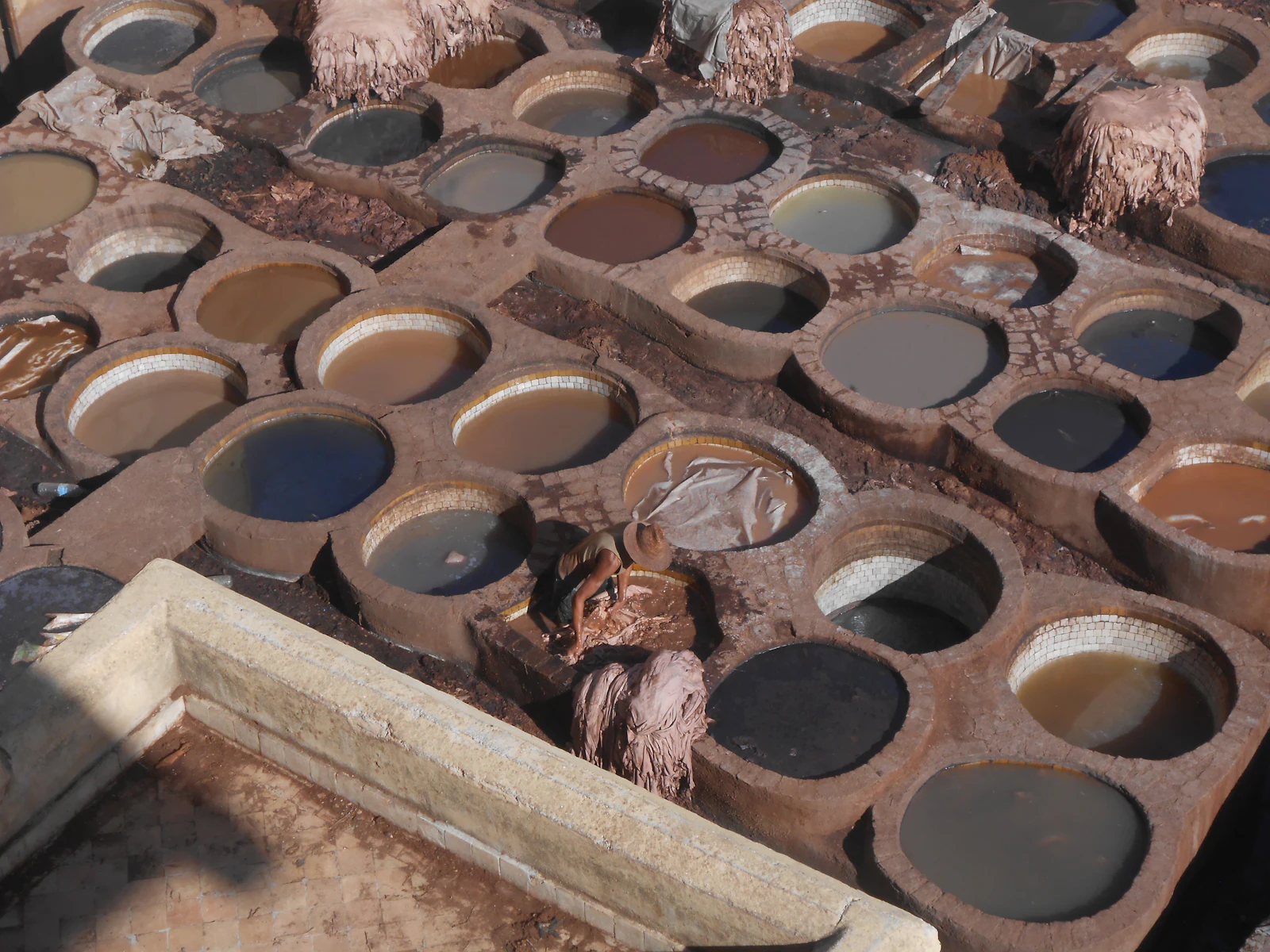 Dye pits filled with colorful liquids at a Fes tannery