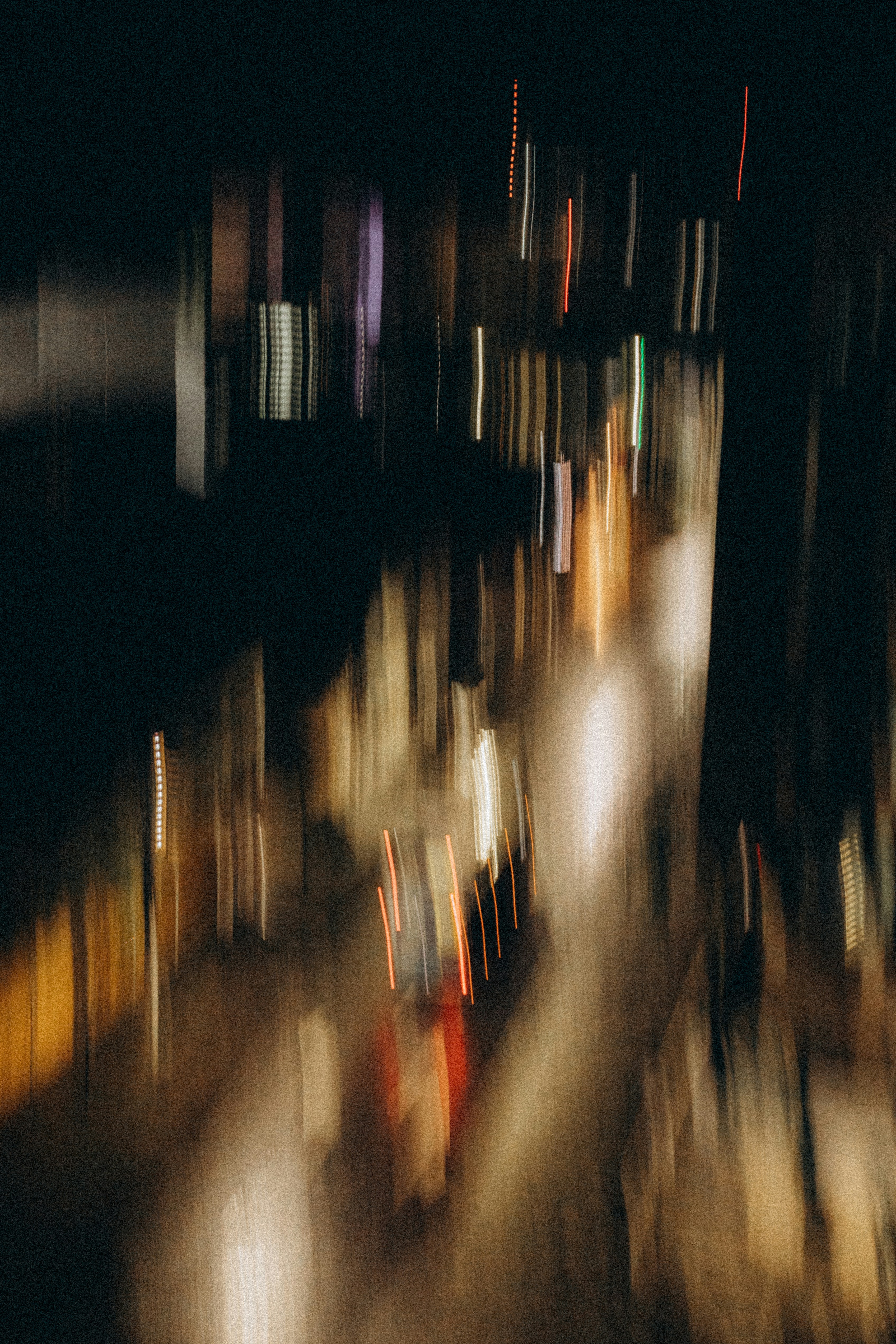 Blurry lights of a city street at night.