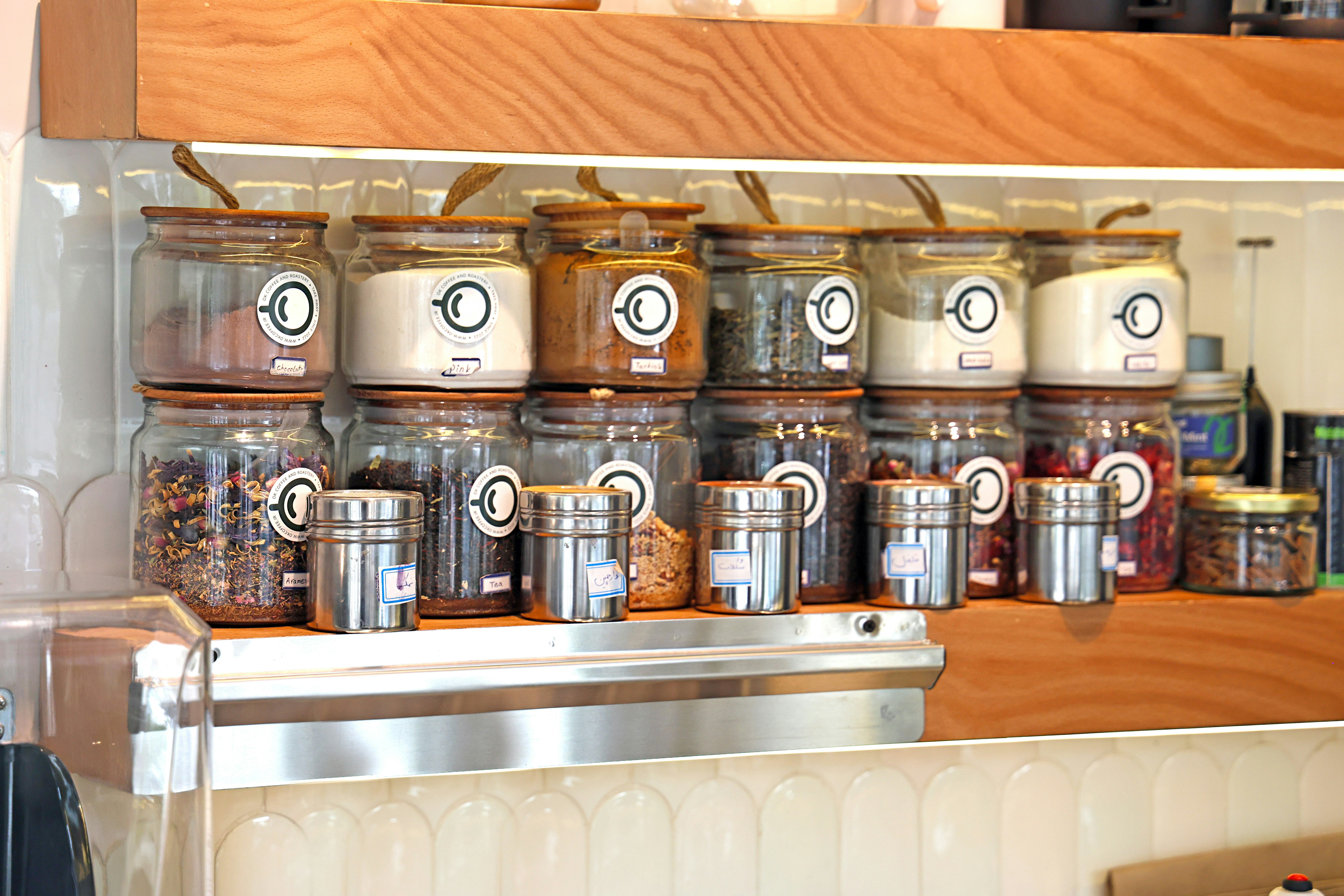 Jars and containers filled with spices and herbs