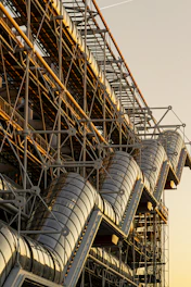 Modern building exterior with glass tubes and metal structure