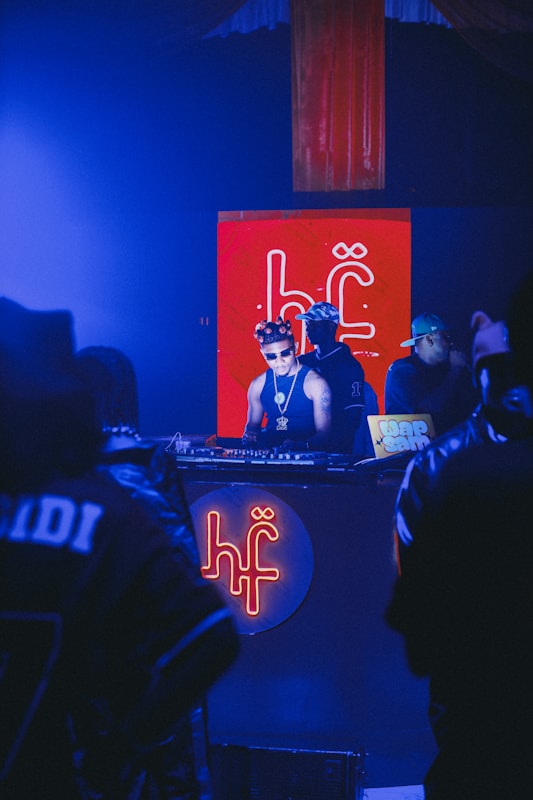 DJ performing with blue stage lighting