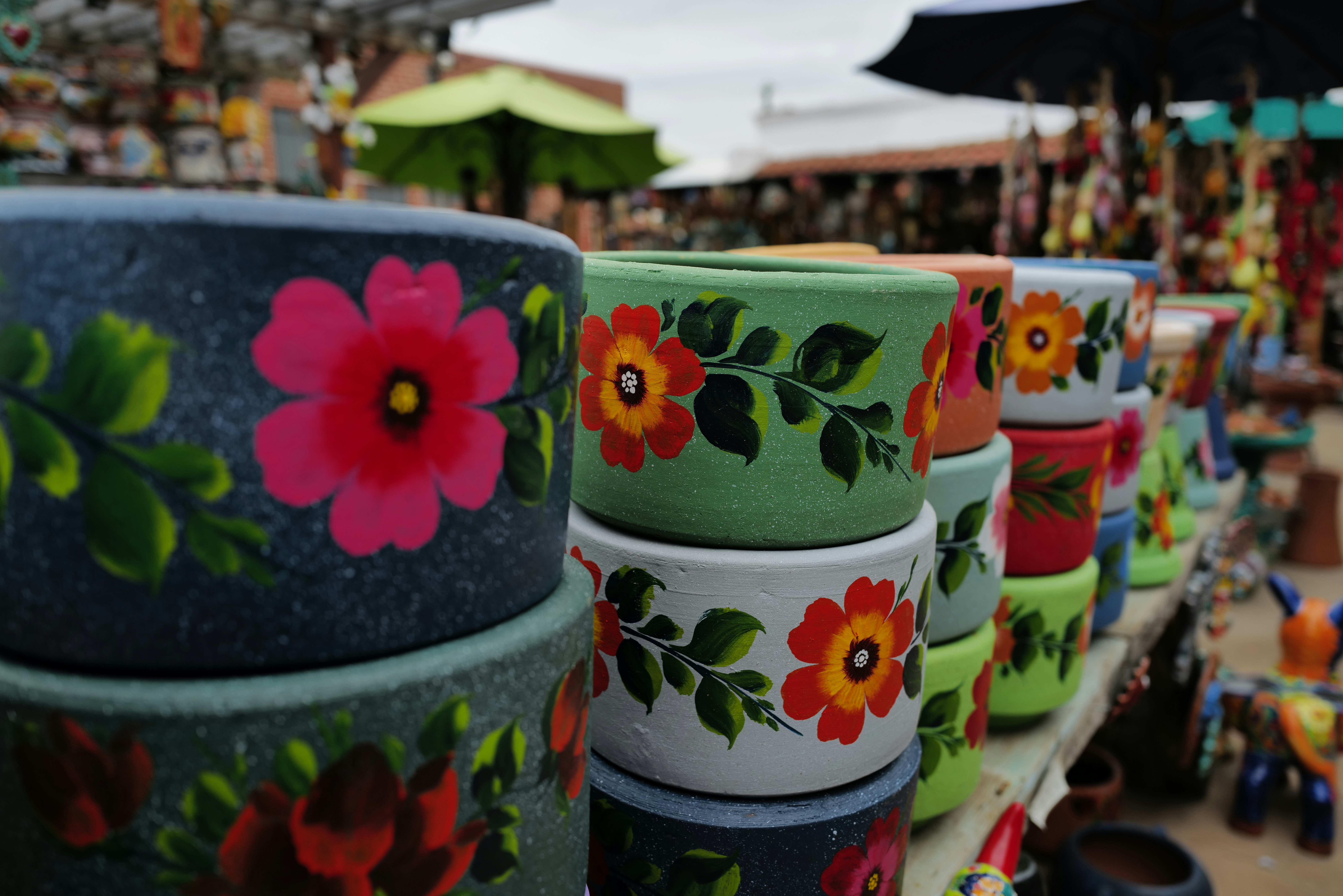 various painted terracotta pot styles from boho to modern - Painted terracotta pot designs