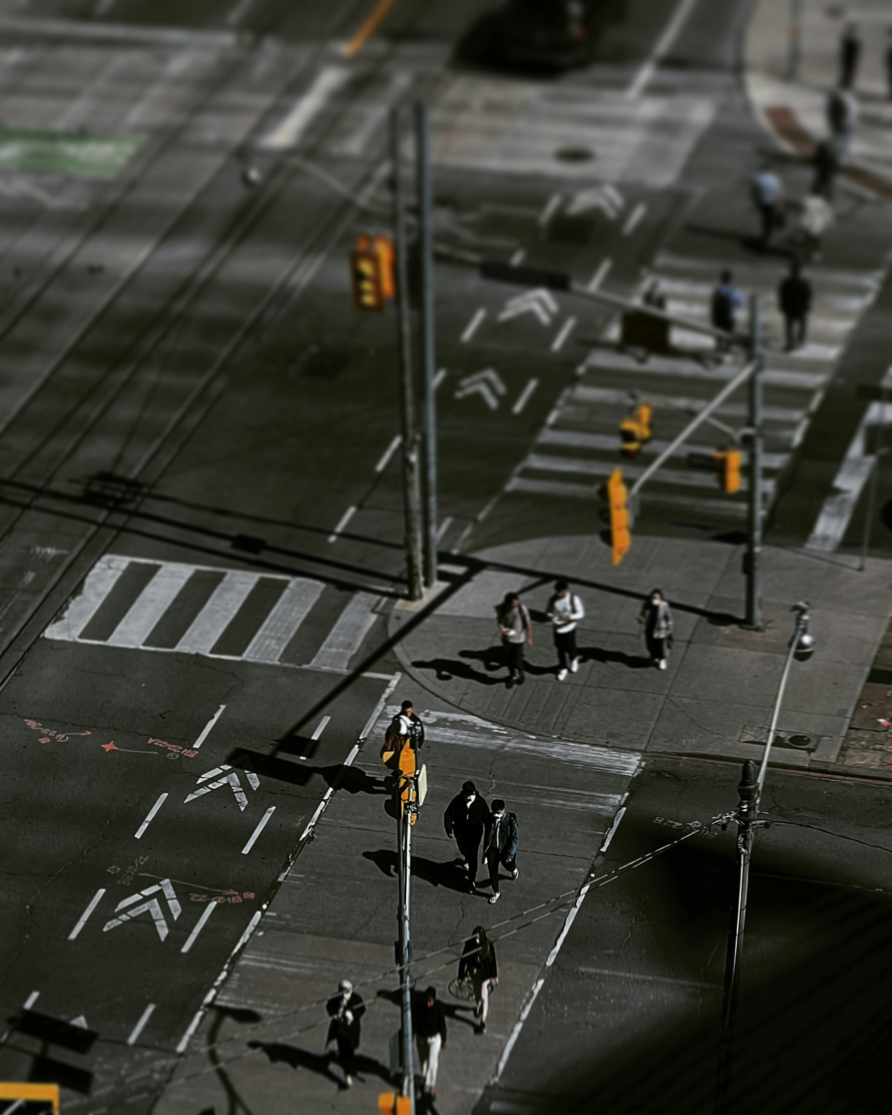People crossing a city street at an intersection