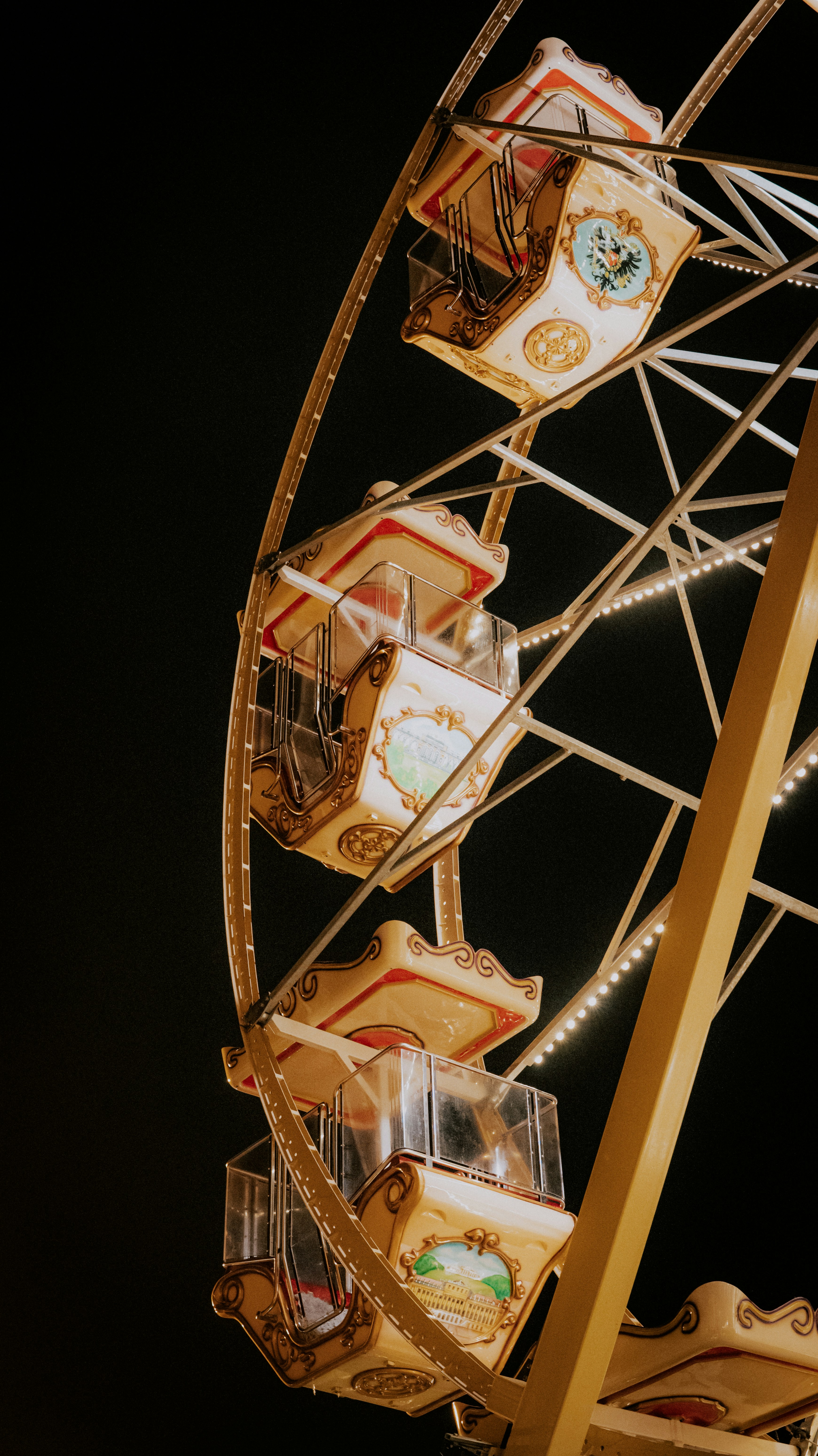 Close-up of a ferris wheel at night