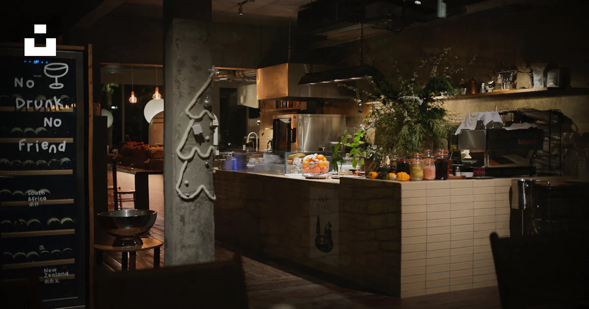 First Kitchen Restaurant Interior of a restaurant kitchen with dining area in foreground photo ...