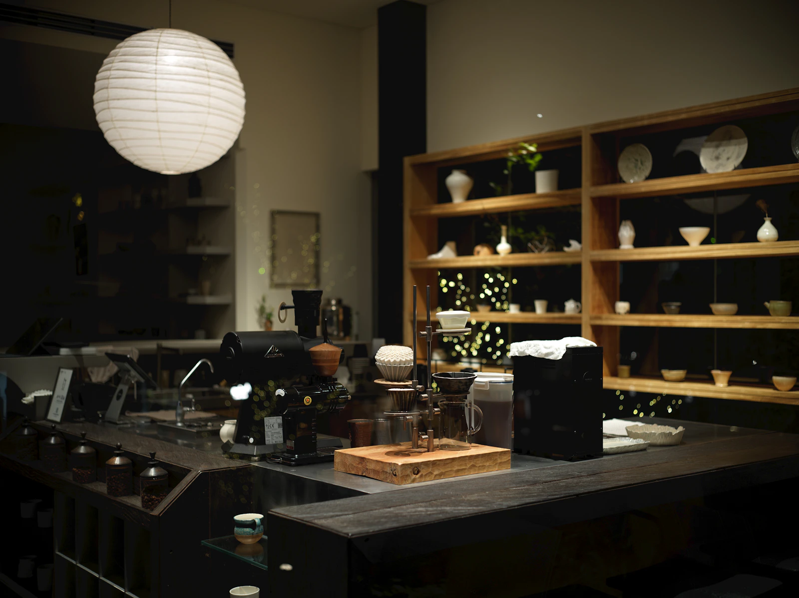 Interior of a modern cafe with shelves of ceramics