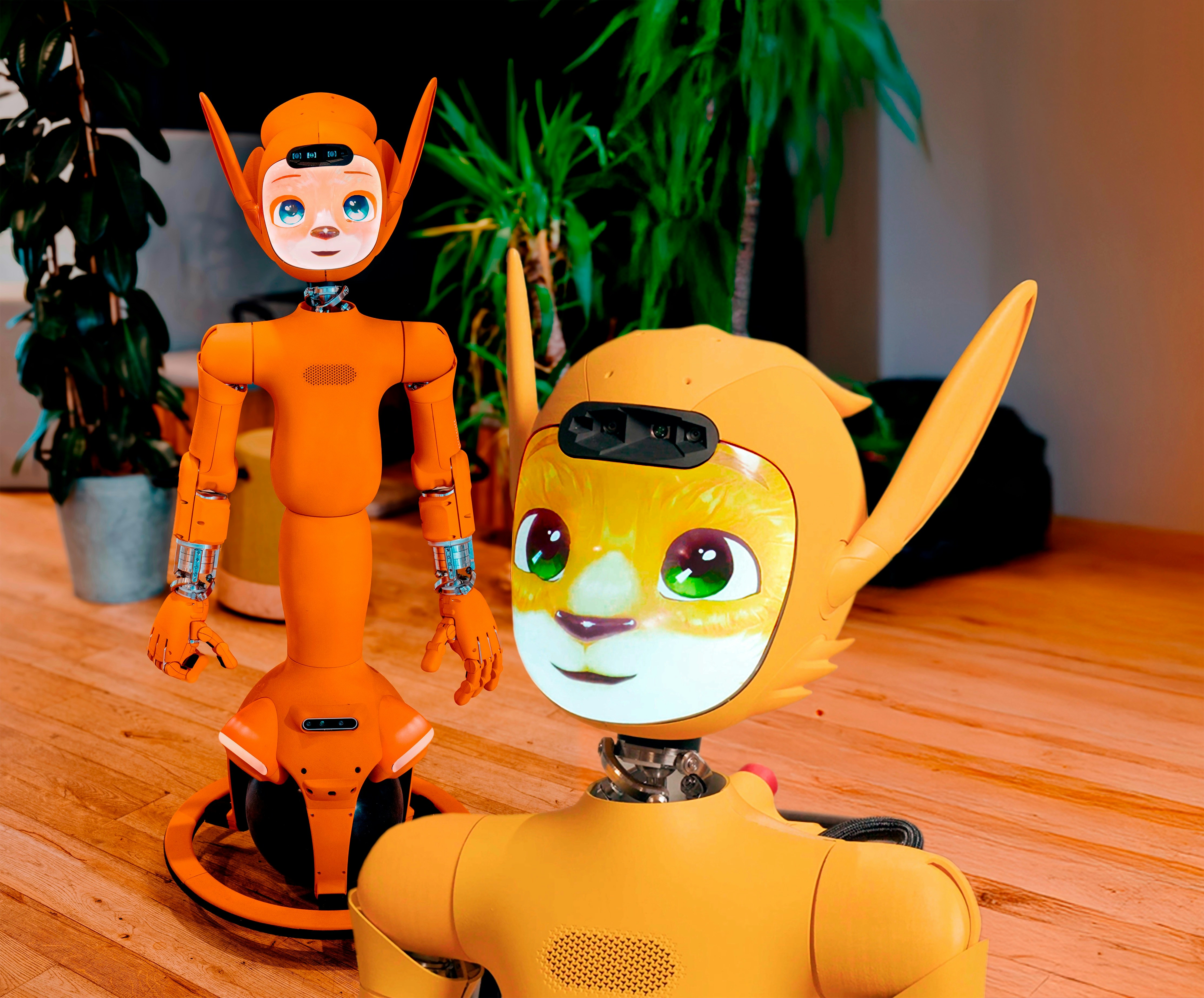 Two orange robots with animal-like features.