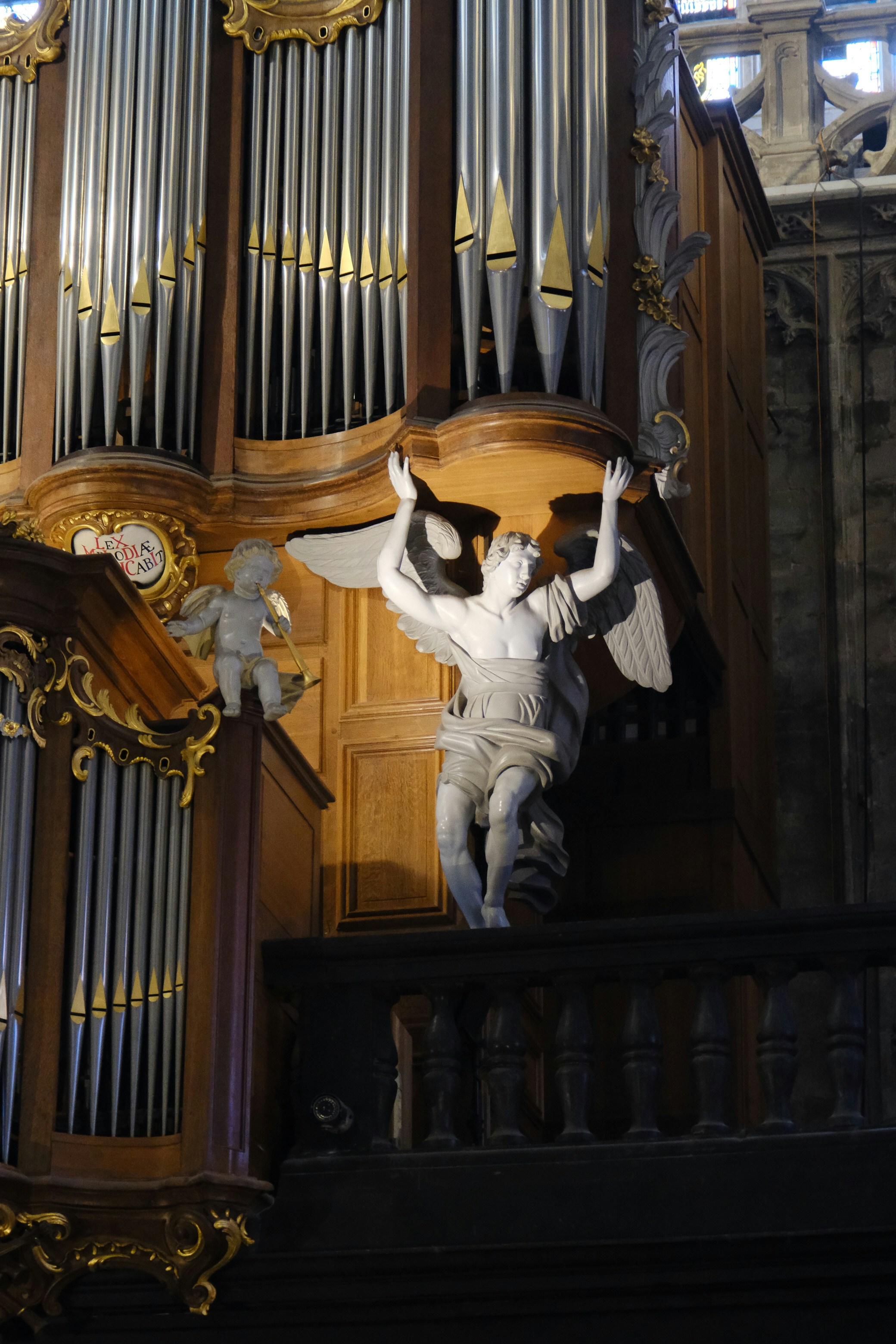Angel statue on a pipe organ in a church