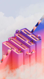 Silver balls rolling down a colorful maze structure