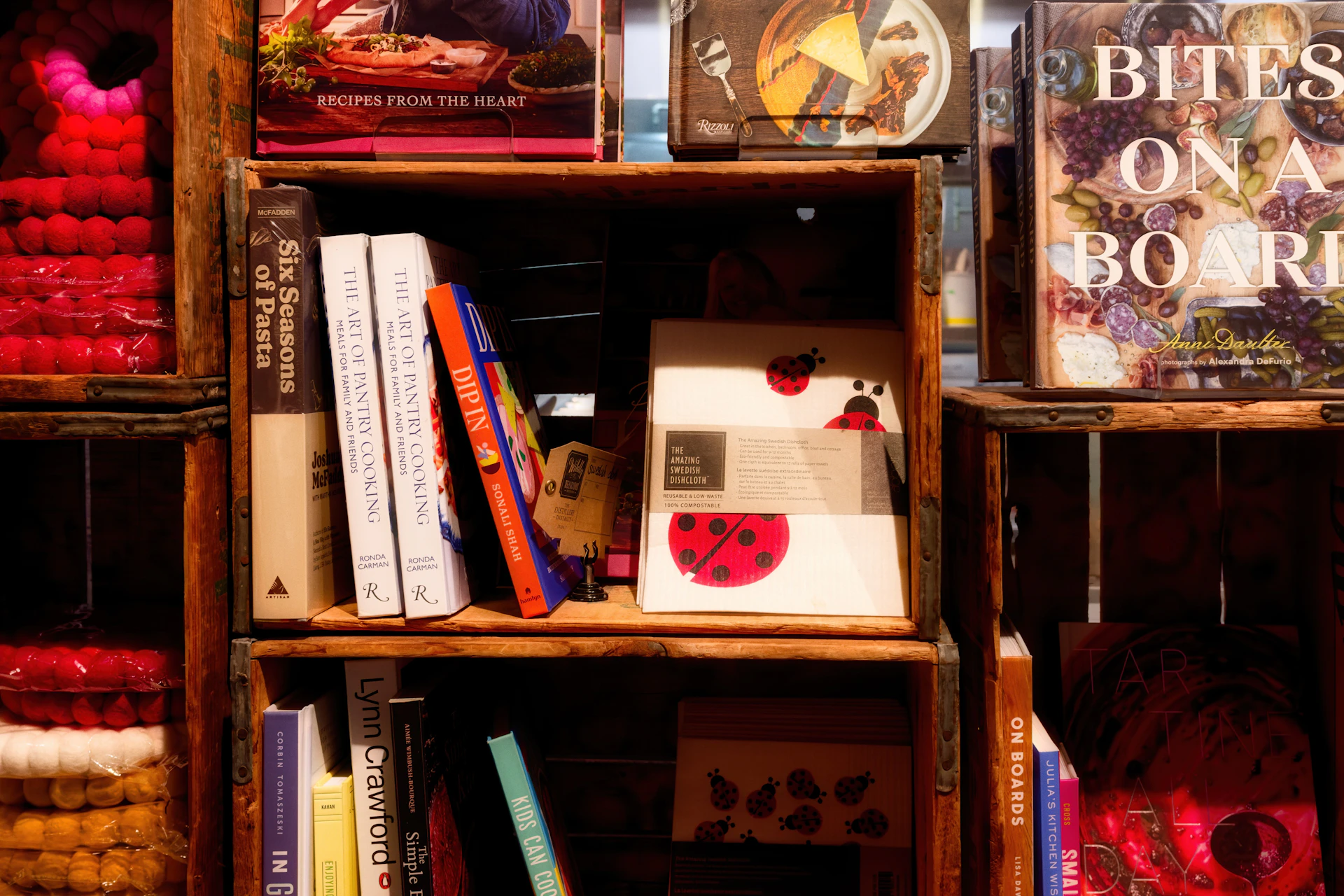 Wooden crates filled with books and decorative items.