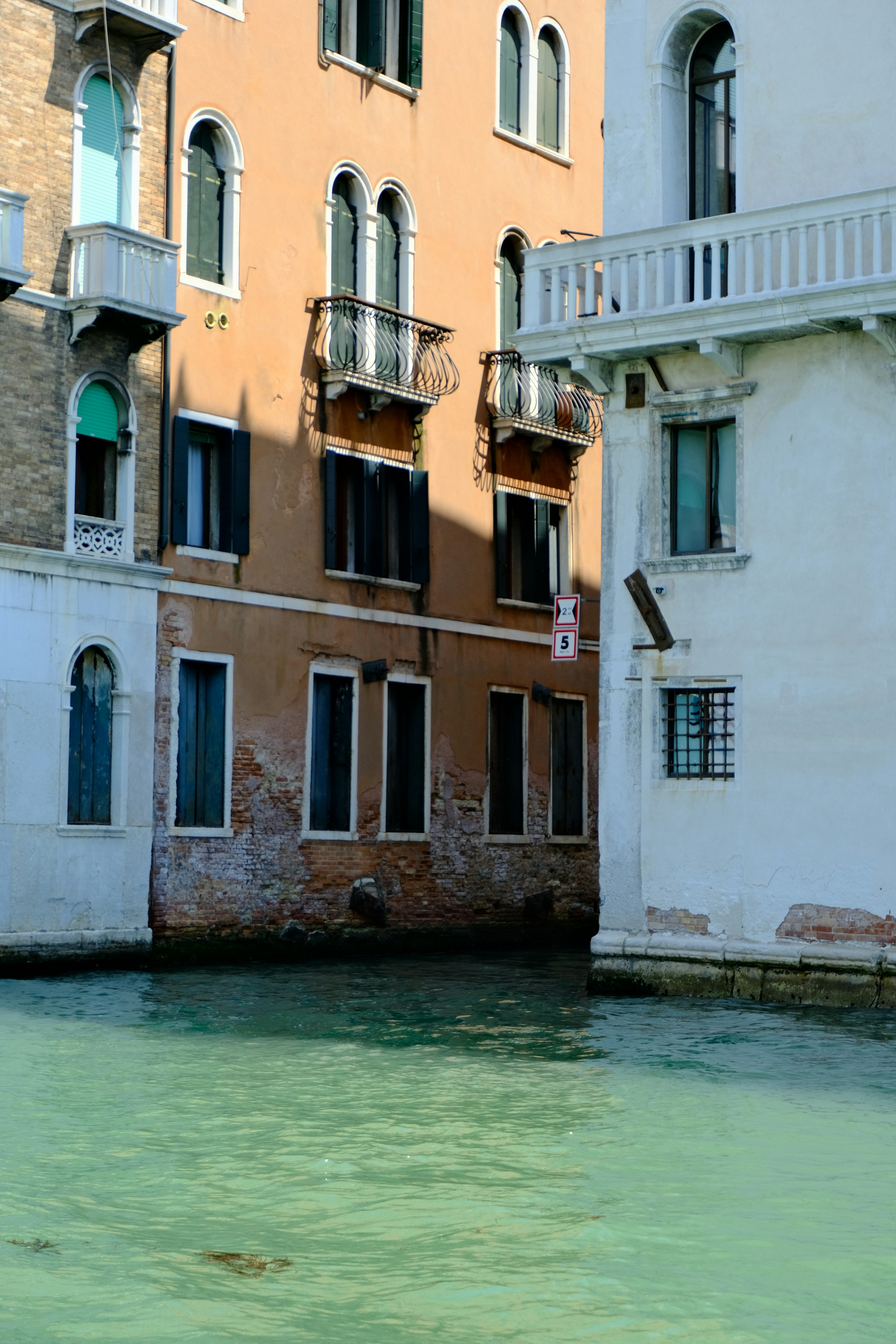 Buildings lining a canal in venice