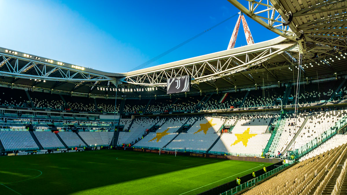 Modern football stadium interior with green pitch
