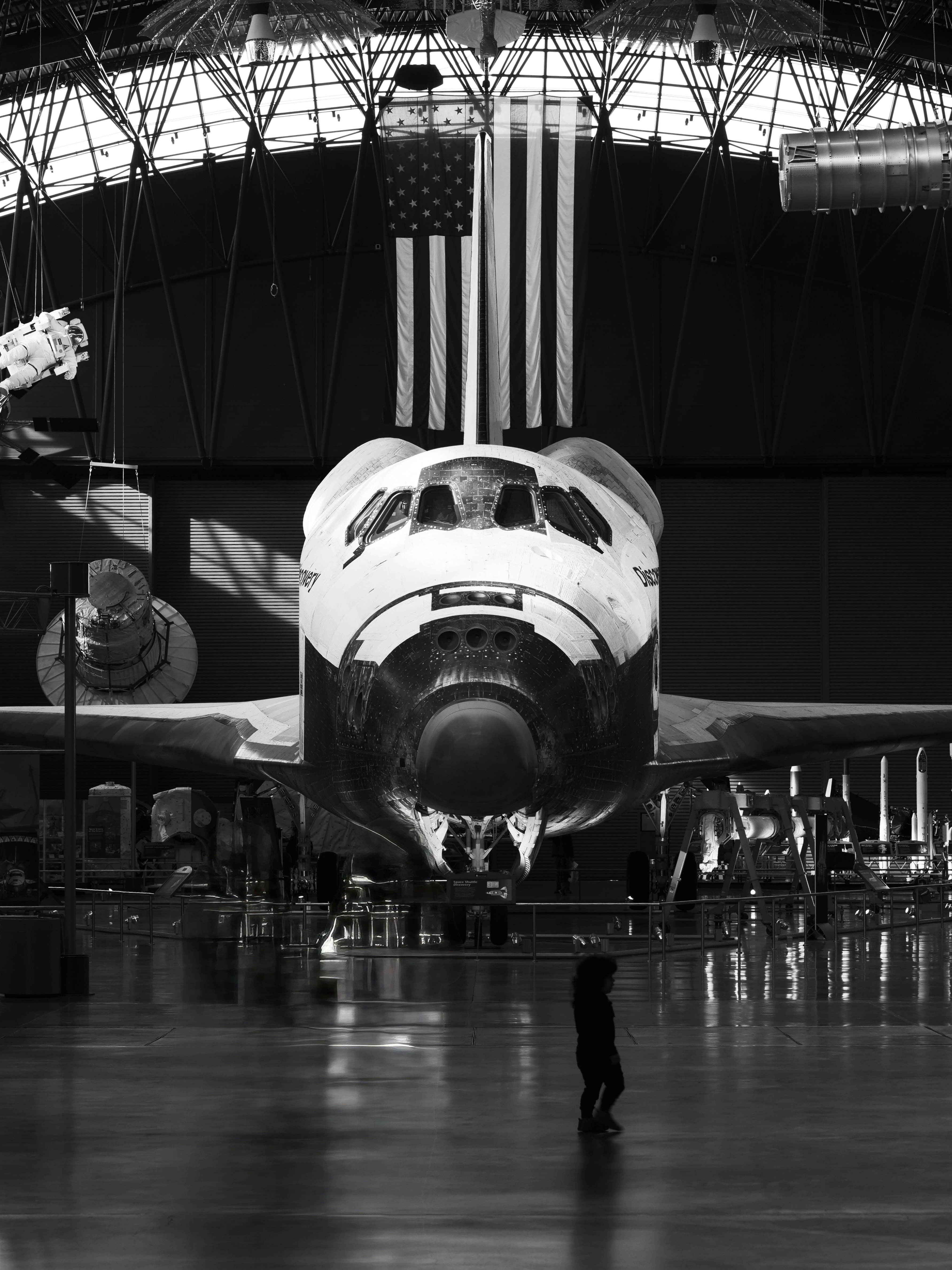 Space shuttle with american flag in hangar