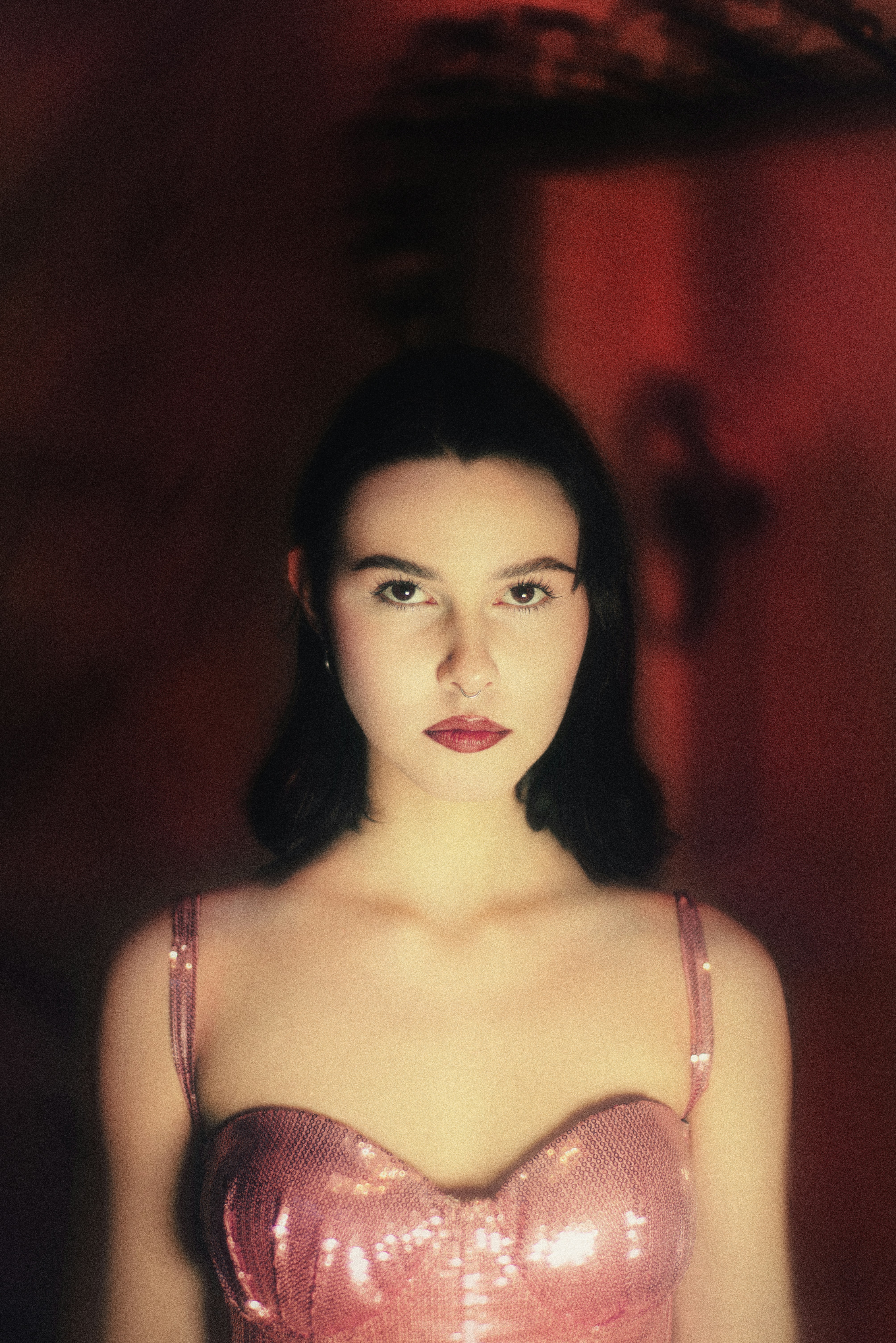Young woman in a sparkly pink dress