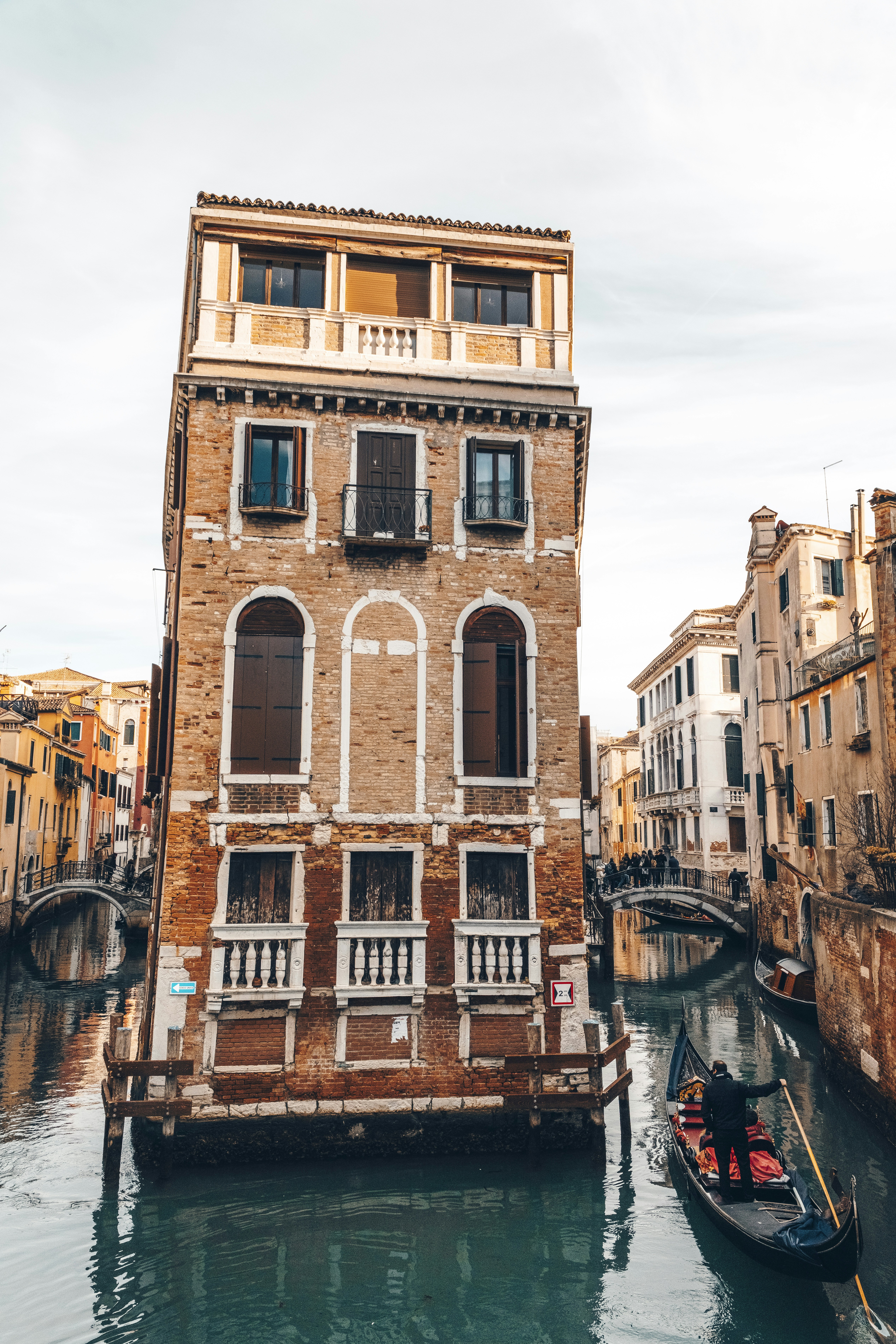 Gondola on a canal in venice with old buildings