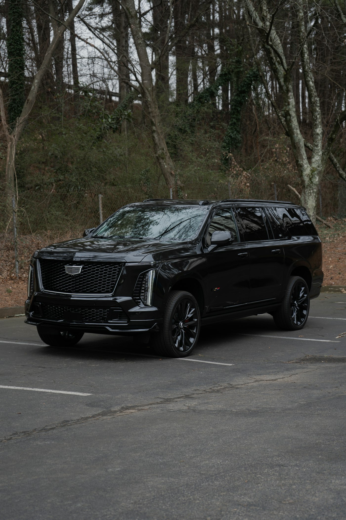 The BlueMiles black Cadillac Escalade