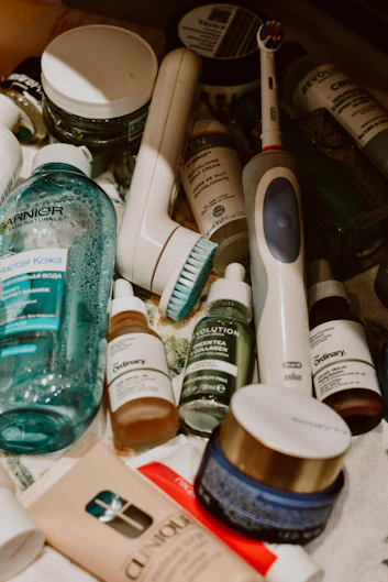 Skincare, toiletries, and personal care essentials arranged for packing and travel.