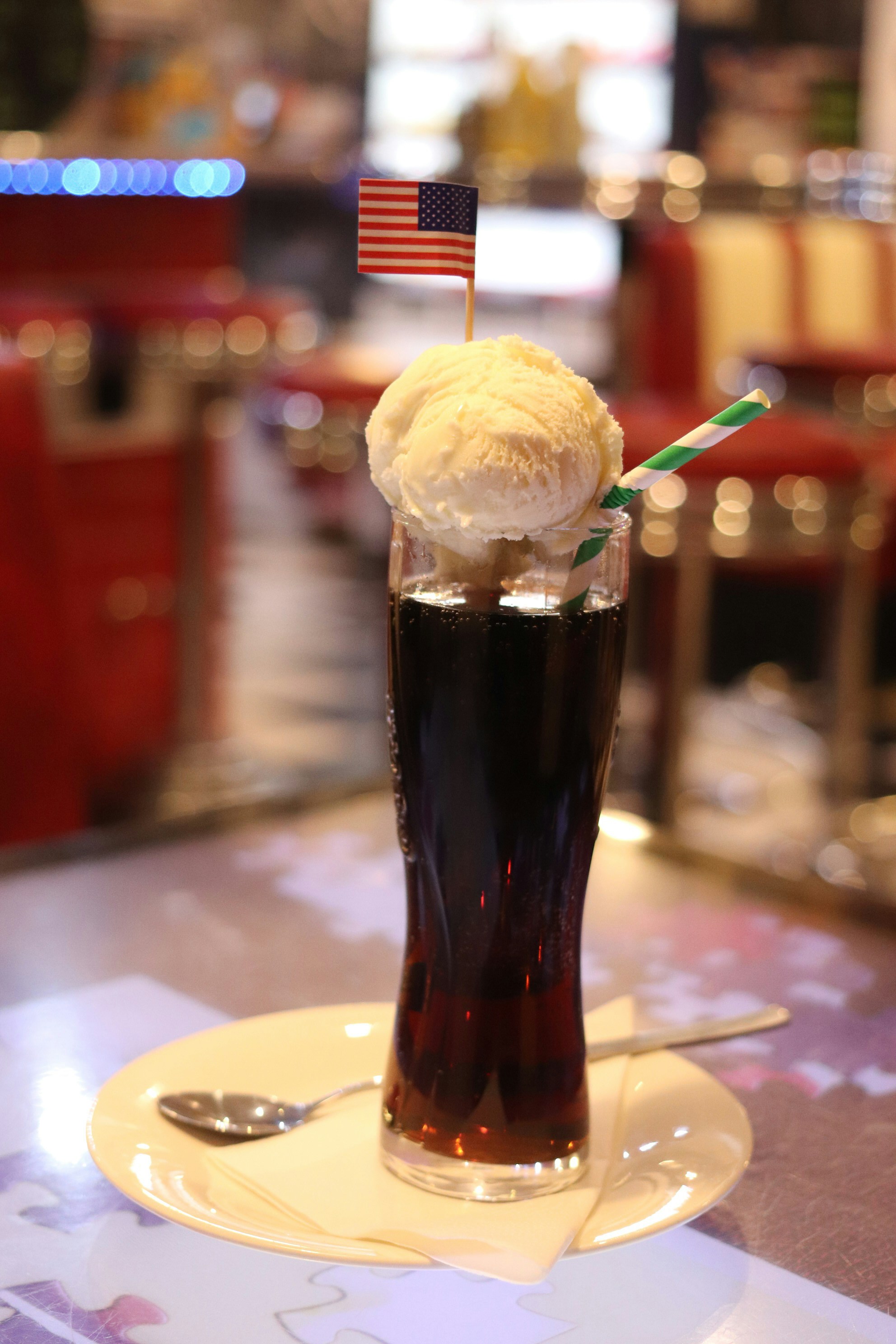 Root beer float with american flag and straw