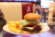 Cheeseburger with fries and american flag decoration