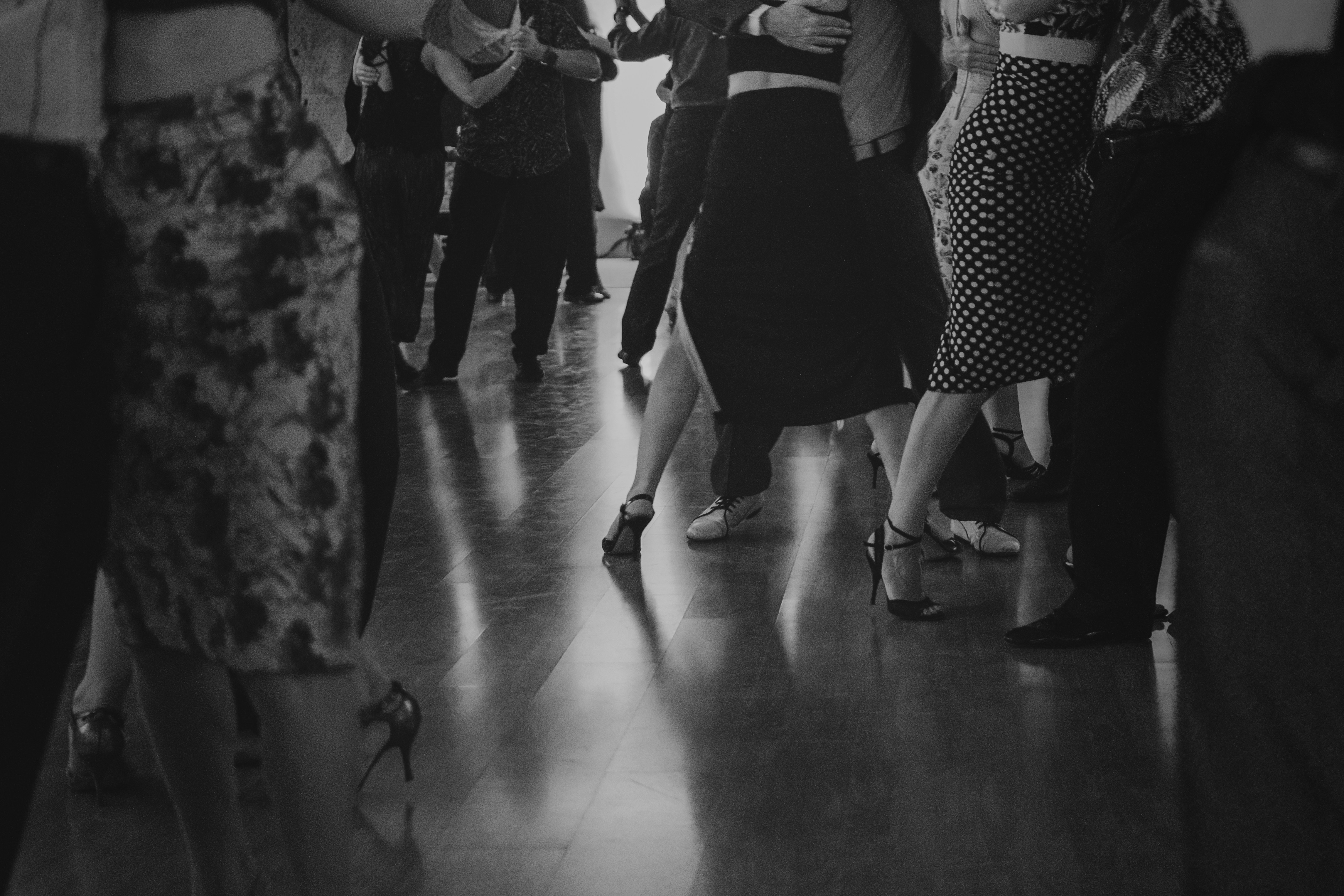 Couples dancing on a polished floor