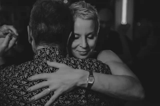 Couple embracing while dancing closely together