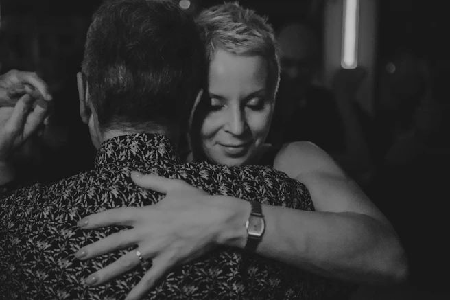 Couple embracing while dancing closely together