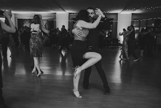 Couple dancing tango in a ballroom
