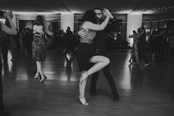 Couple dancing tango in a ballroom