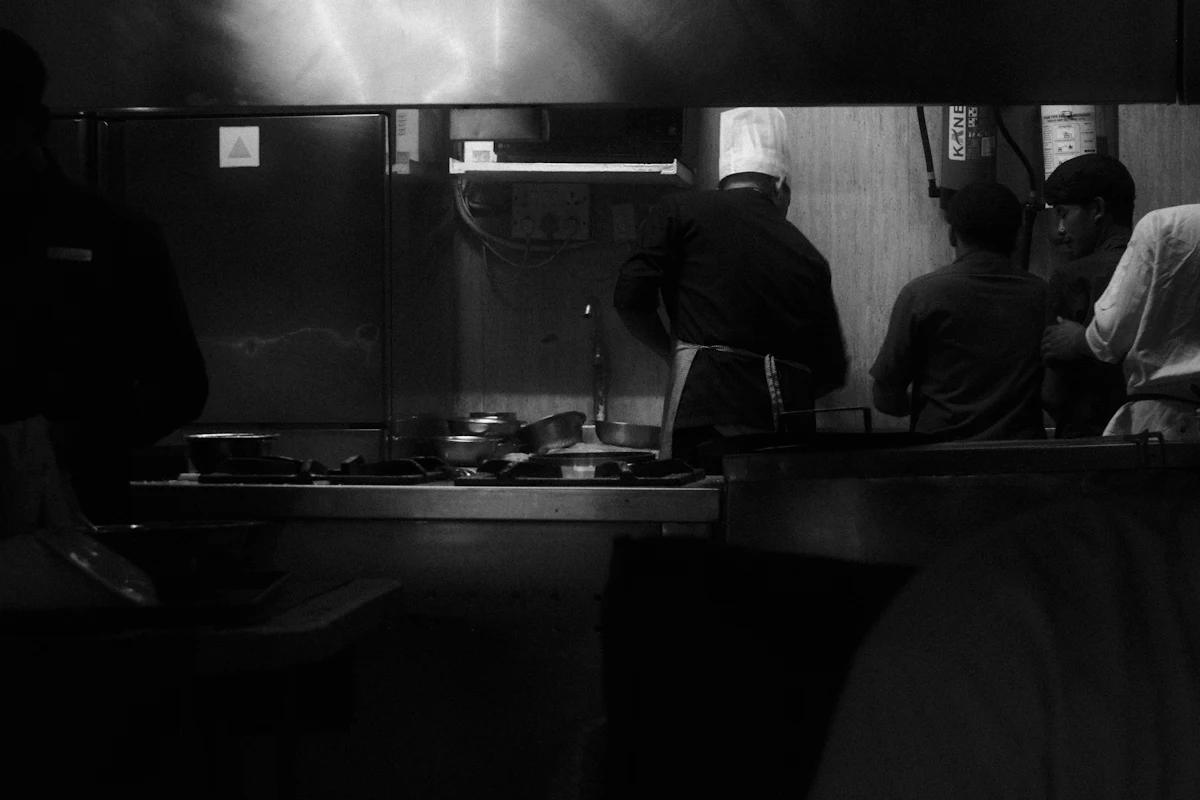 Chefs working in a busy commercial kitchen