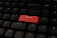 Close-up of a red enter key on a keyboard