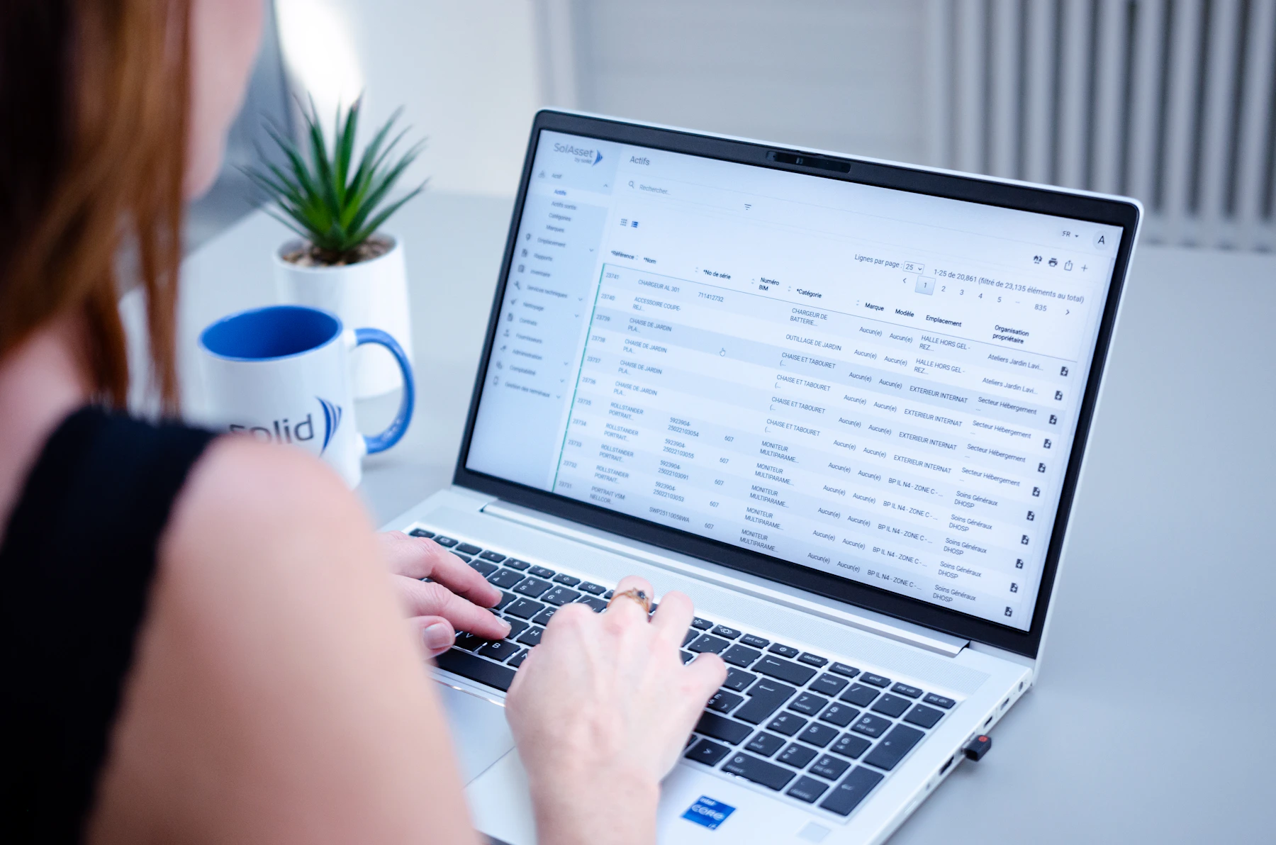 Person working with messages and information on a laptop