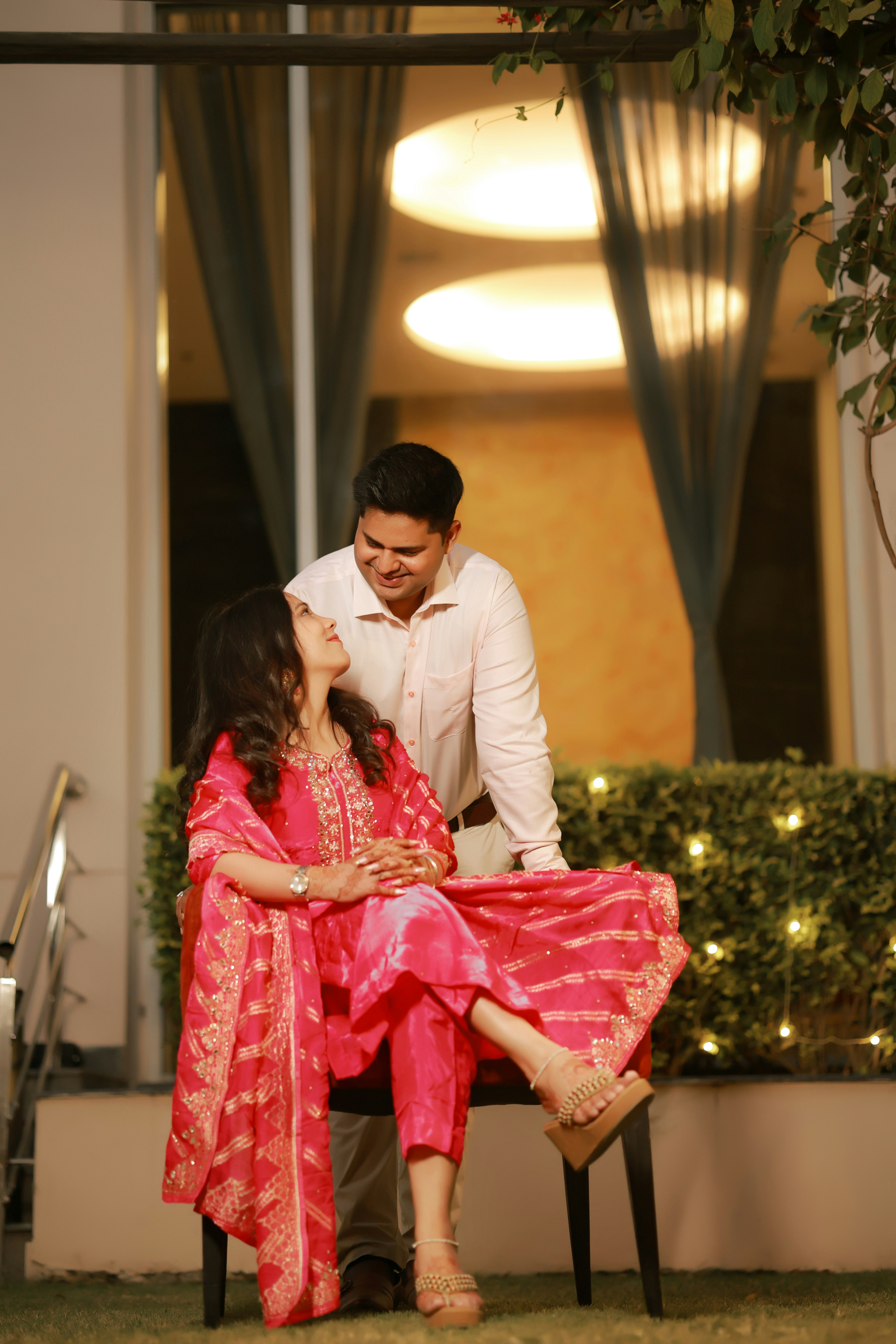 Couple looking at each other outdoors at an outdoor gathering.