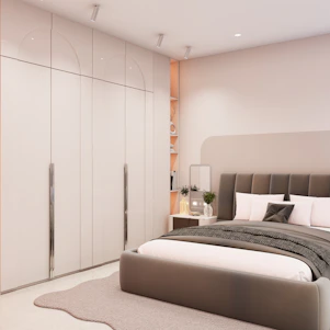 Modern bedroom with large wardrobe and bed.